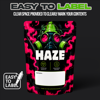 A stand-up resealable pouch package on a dark background with the text 'EASY TO LABEL' at the top and a white 'EASY TO LABEL' badge at bottom left. The pouch has a black base with bright pink smoke-like graphics, a green gas mask illustration, large white 'HAZE' text, and a blank white contents window near the bottom.